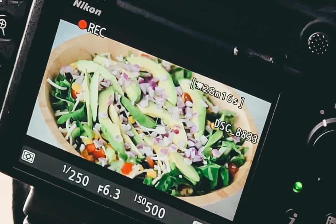 a camera recording a salad being made.